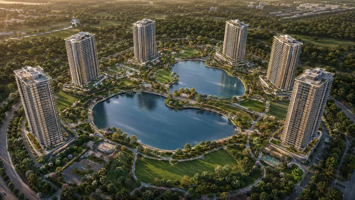 Assetz Twin Lake City lakefront aerial of the twin-lake campus with six towers at golden hour